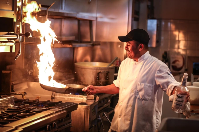 Chef preparing food in a professional UAE foodservice kitchen