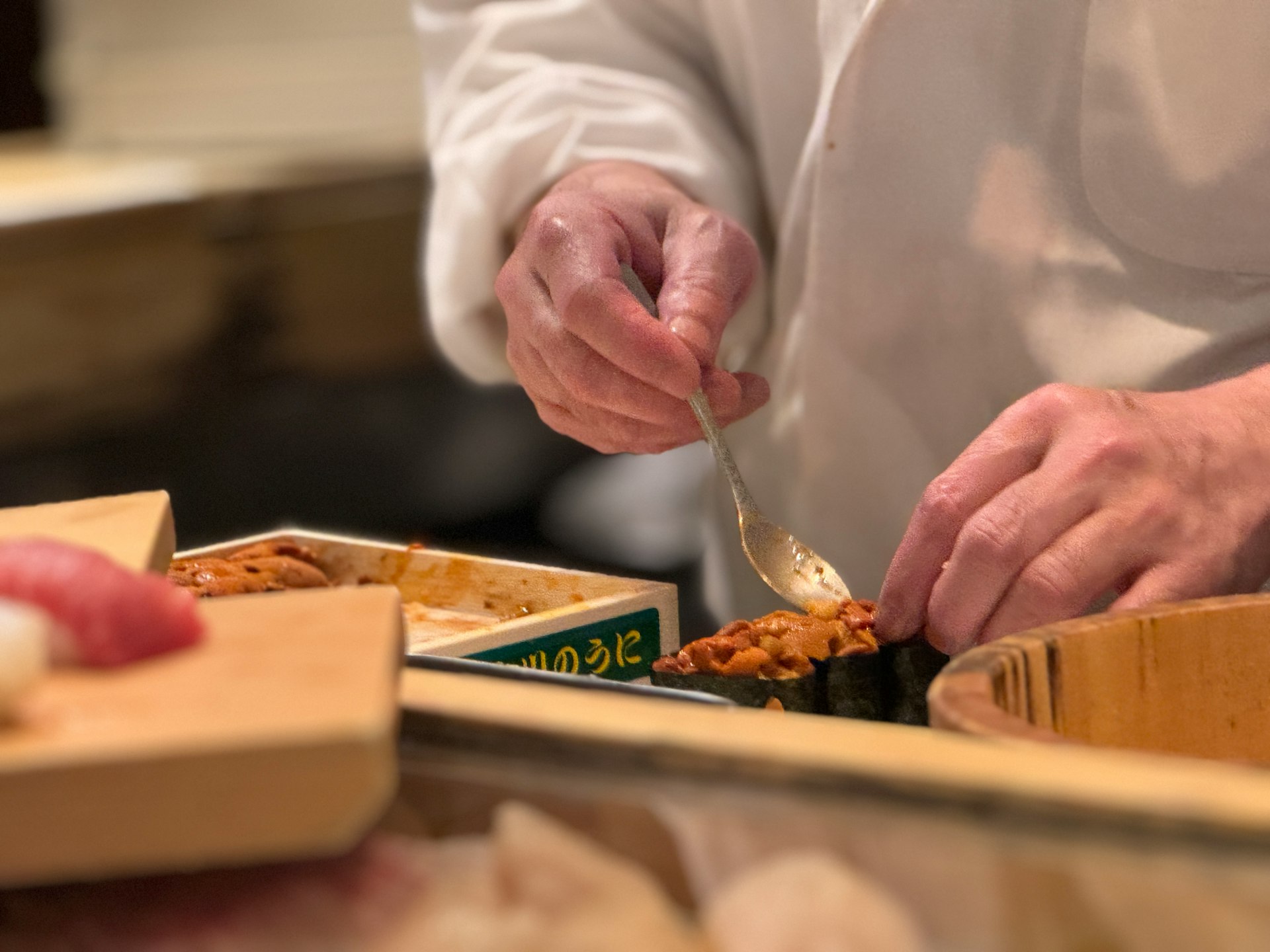 A chef is preparing food in a kitchen