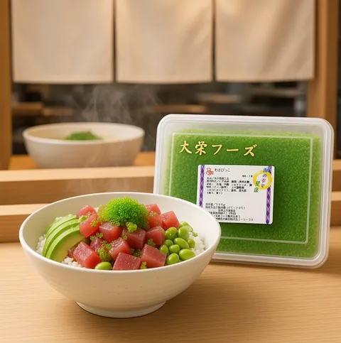 Tuna poke bowl with rice, avocado, edamame and a spoonful of green tobiko beside a Daiei green wasabi tobiko tray
