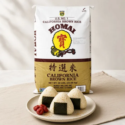 Three brown rice onigiri with pickled plum in front of a Homai California brown rice sack