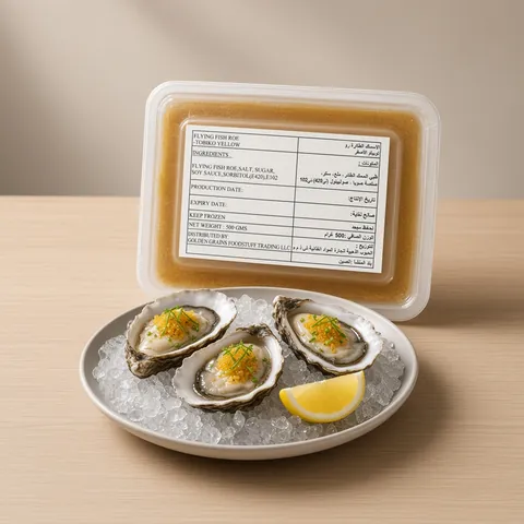 Oysters on ice topped with ponzu, chives and yellow tobiko in front of a GGFT yellow tobiko tray