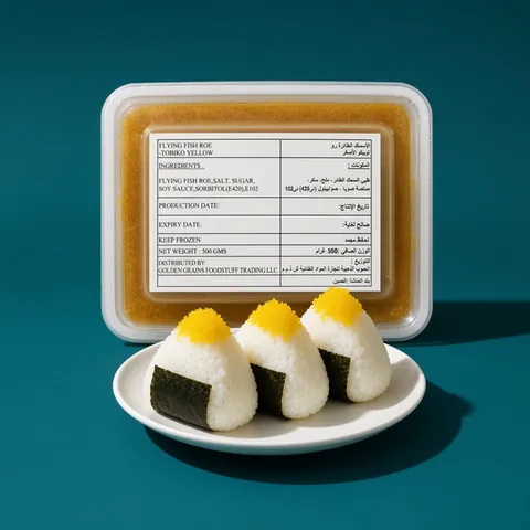 Onigiri rice balls topped with yellow tobiko in front of a GGFT yellow tobiko tray