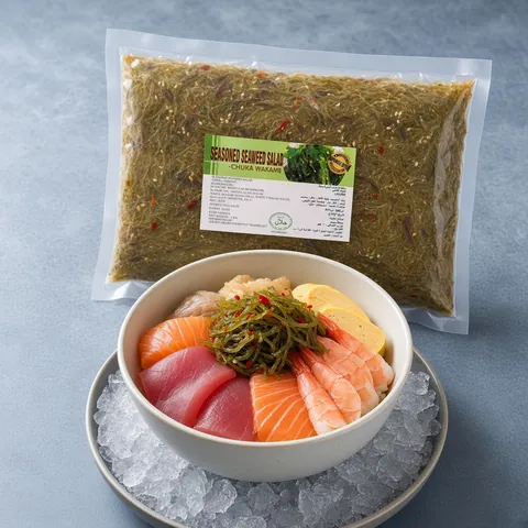 Chirashi bowl of salmon, tuna, prawn and tamagoyaki with spicy seaweed salad on ice in front of a GGFT spicy chuka wakame pack