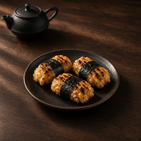 Three isobe-yaki grilled rice cakes wrapped in nori strips