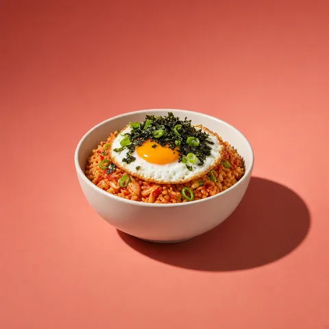 Kimchi fried rice topped with a fried egg and crumbled nori